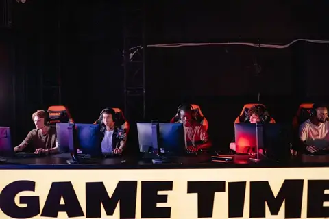 NAVI Valorant player competing on stage at a VCT EMEA event in branded team jersey