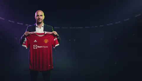 Youri Tielemans holding a Manchester United shirt at his signing announcement, July 2026
