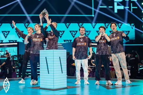 Large esports arena stage with dramatic blue and purple lighting before a major Dota 2 championship
